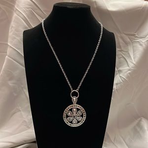 Silver floral pendant necklace.